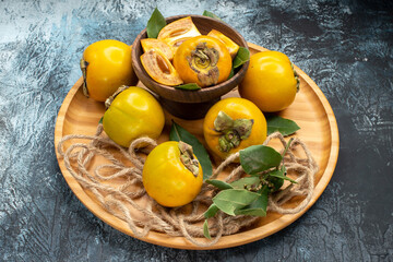 front view fresh sweet persimmons on dark background tree taste ripe fruit