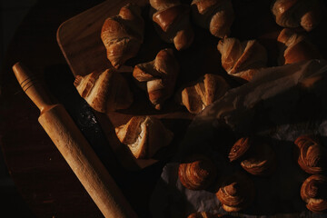 delicious homemade croissants lie on a wooden board