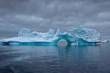 Iceberg arch in Disko Bay, Ilulissat, West Greenland