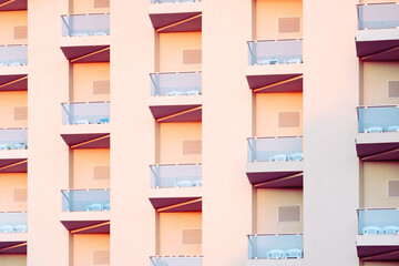 Geometry in building facade design. Abstract details of repetitive patterns of balconies . in modern apartment building. Architecture design concept