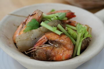 The Asian style baked tiger prawns in the hot clay pot with some gingers and Chinese celery. Spicy grass noodle with the seafood dish.
