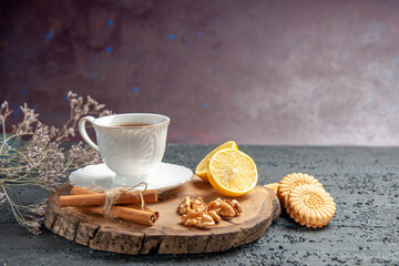front view cup of tea with lemon and cookies on dark background photo ceremony