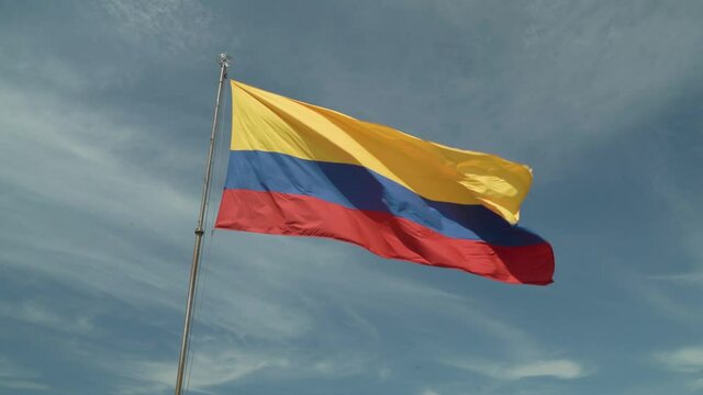 Castillo de San Felipe de Barajas and Colombian flag on the wind 