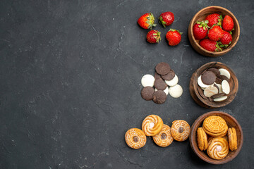 top view choco cookies with strawberries and biscuits on dark background fruit sweet biscuit