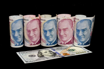 Turkish lira and American dollar bills. Turkish lira plunges, crashing. Turkey's lira crisis. Turkish lira is going down.