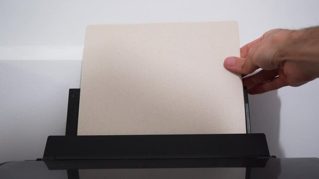 Working from home setting-up printer, loading paper for printing