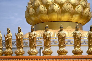 The little golden Bodhisattva (Guanyin) in mercy pang blessing all beings are located at the base of the Great Kuan Yin Goddess at Fo Guang Shan Thaihua Temple, a branch temple from Taiwan
