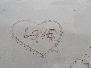 Draw a heart shape around the text 