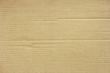 Brown corrugated paper texture background with space for design.