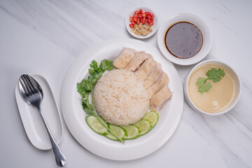 Hainanese chicken rice. Roasted Chicken Rice with soup, vegetable and Garlic, chili, ginger sauce.