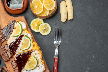 top view yummy cake slices with chocolate on dark background dessert pie cake sweet