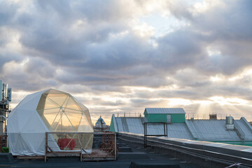 Fototapeta premium Plastic dome-tent on the roof in St. Petersburg