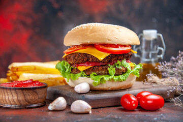 front view meat burger with cheese salad and tomatoes on dark background sandwich meal bun