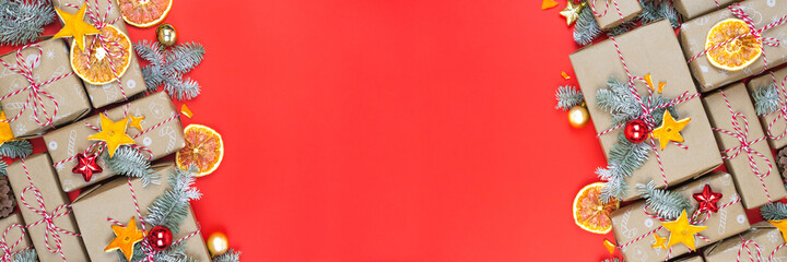 Many craft gift boxes on red background.Christmas holiday package banner template with copy space