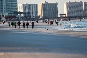 people walking on the beach