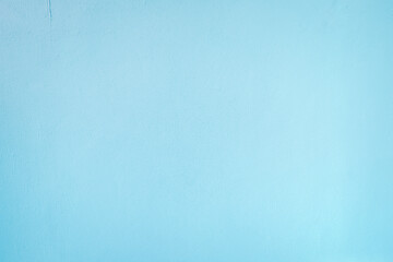 Abstract weathered texture stained old stucco light blue color and aged paint concrete wall background in the room. Grunge decorative pattern on the street.
