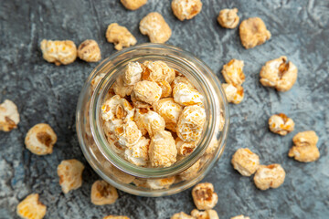 top view sweet popcorn inside glass can on a light background snack movies sugar