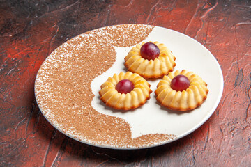 front view yummy little cookies inside plate on dark background sweet biscuit cake