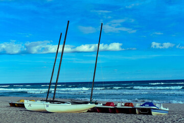 Catamarans and paddle boats on the beach