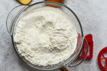 Flour in yhe bowl top view, baking food concept