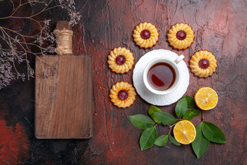 top view cup of tea with little cookies on the dark background dessert biscuit sweet