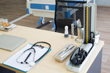 Stethoscope and laptop and other medical object on table of doctor.