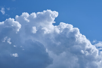 Naklejka na ściany i meble Cumulus clouds against the blue sky, nice background.