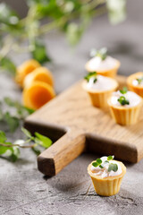 Canapes with light cream filling. Still life with microgreens. The concept of an appetizing snack.