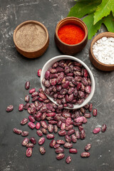 top view fresh raw beans with seasonings on grey floor food raw color pepper