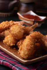 Battered prawns fried in brown and ketchup