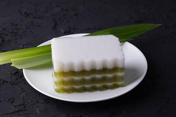 Pandan jelly and coconut milk are layers.