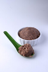 Green spoon shrimp paste on white background