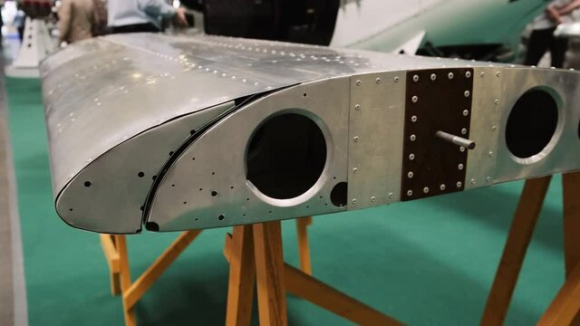 Demonstration of the aircraft wing structure. Sectional plane wing. Front, rear spar, rib, flap, slat and other wing elements. Closeup view