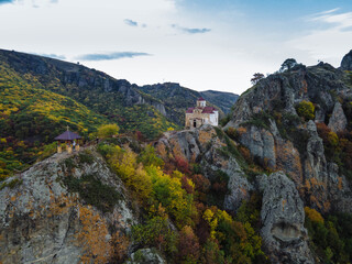 Shoanin christian temple. X century. Karachay-Cherkessia, Dombay, Russia. Mountain, outdoor. Drone shooting
