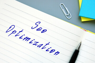 Business concept about Seo Optimization with inscription on the sheet.