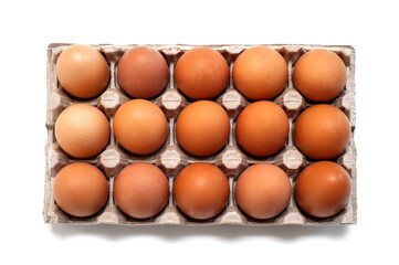 Brown raw chicken eggs in a cardboard box for eggs.Food background.