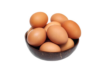 Brown raw chicken eggs in a cup on a white background. Food background.