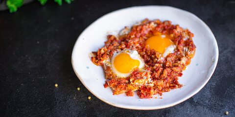 breakfast eggs fried tomato, onion and vegetables shakshuka omelette natural snack on the table healthy meal snack top view copy space for text food background rustic 