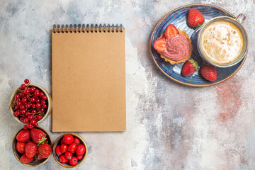 top view cup of coffee with cake and red fruits on light background sweet biscuit cakes