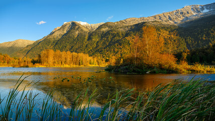 Autumn sunset panorama format photo of Cheam Lake Wetlands Regional Park with the Mount Cheam in the background, Rosedale,