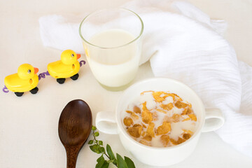 mix corn flakes, milk healthy foods for children eats and healthy drinks fresh milks in breakfast decoration flat lay style on background wooden white