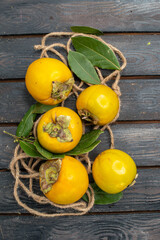 top view fresh sweet persimmons on a wooden rustic desk ripe fruit tree taste