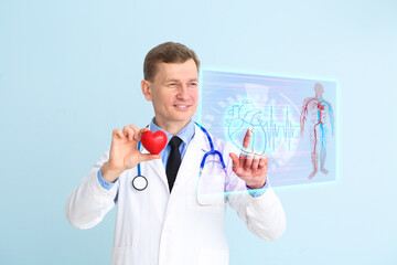 Male cardiologist using virtual screen on color background