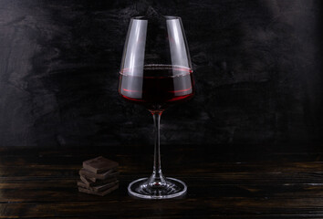 A glass of red wine and chocolate