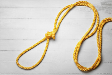 Rope with knot on light background