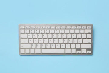 Computer keyboard on color background