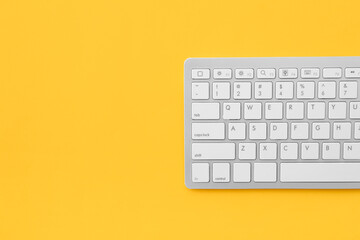 Computer keyboard on color background