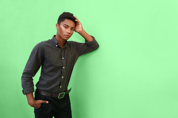 Fototapeta premium Stylish young African-American man on color background