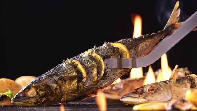 Grilled fish on the flaming grill