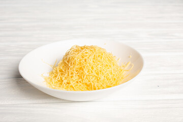 Grated cheese in white plate